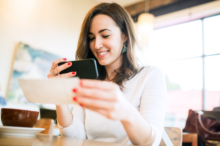 A woman looking at a cell phone