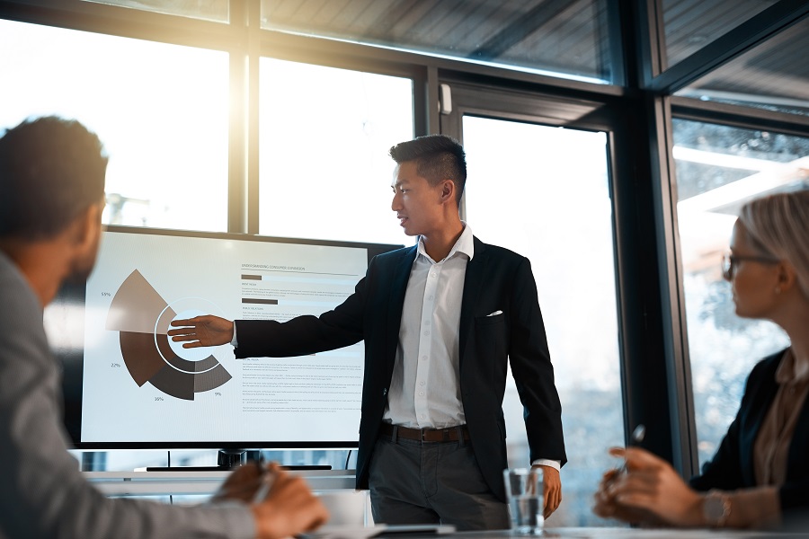 Photo of a young businessman giving a presentation to his colleagues in an office