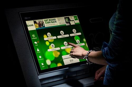 Woman using NCR ATM Software