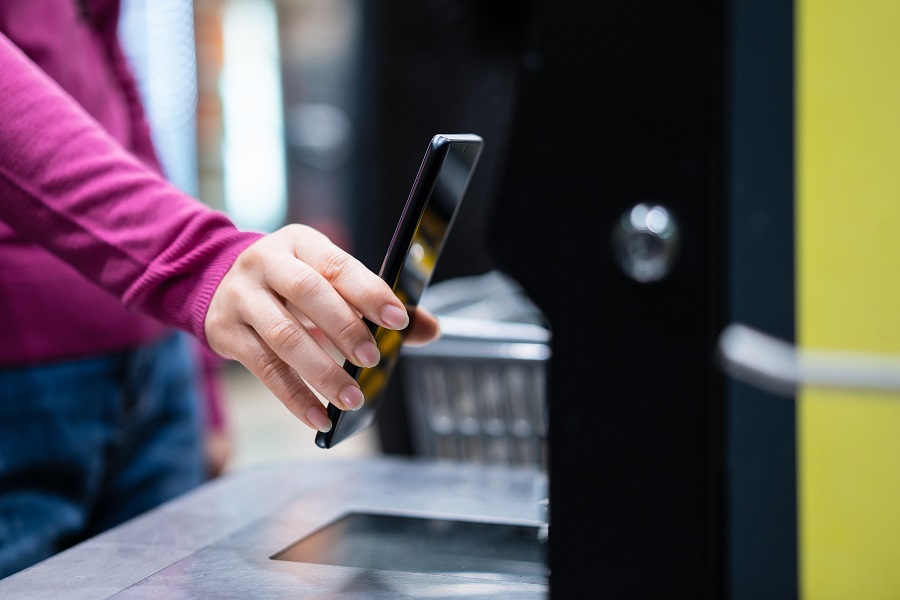 asian female  contactless payment on automatic payment machine in supermarket