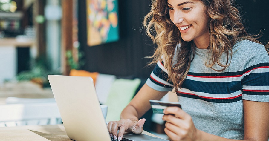 A woman with card using online payment