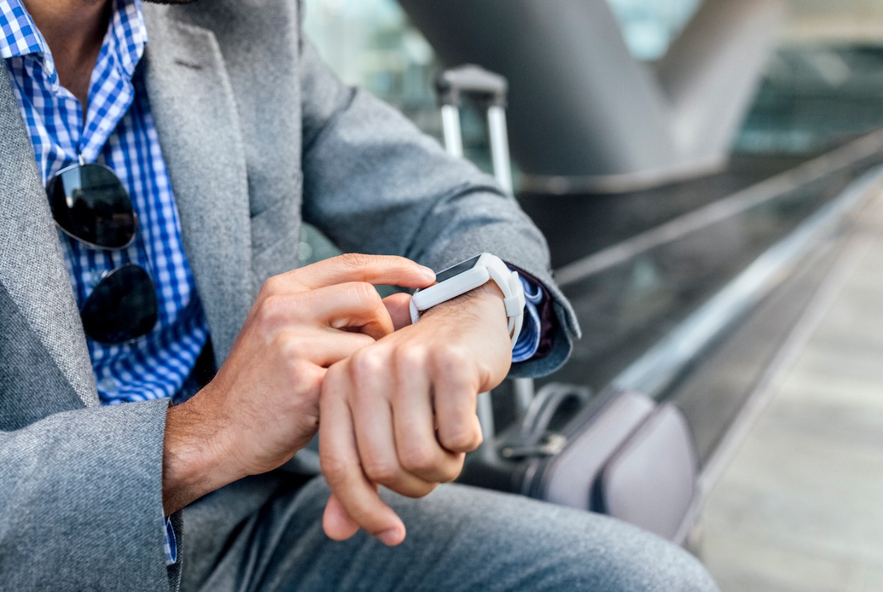 Male man professional using smart watch outside