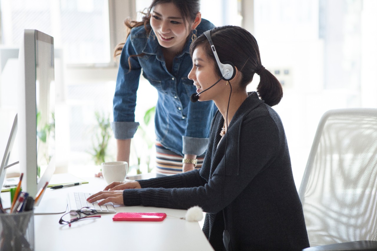 young women using telecom and technology services