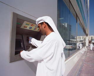 Saudi Investment Bank, man at ATM