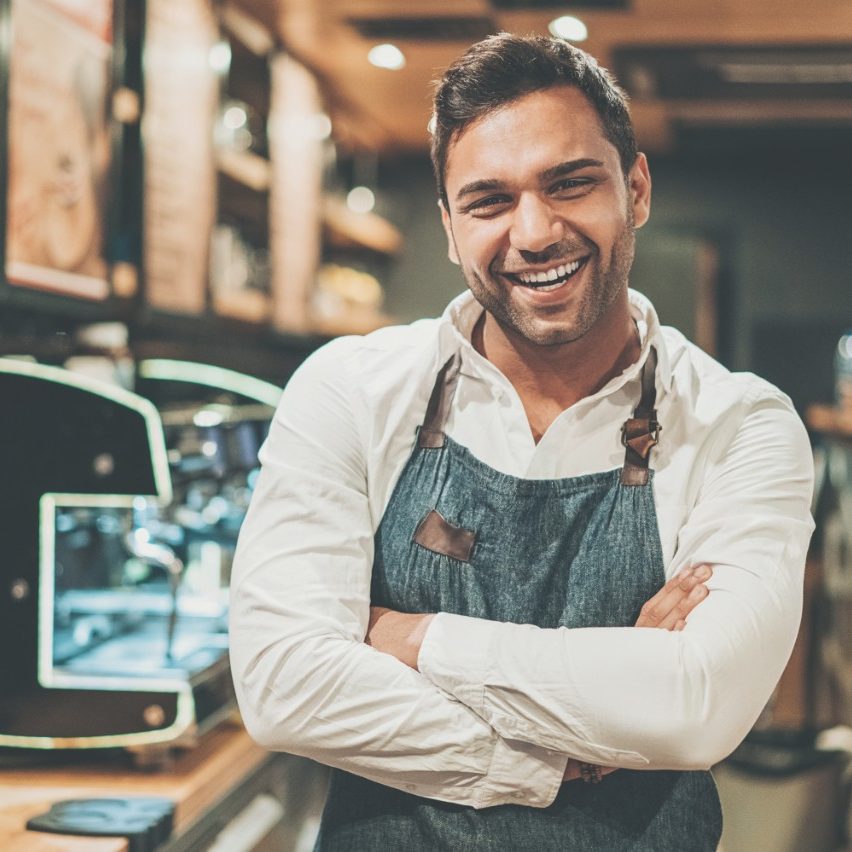 Smiling barista in a coffee shop