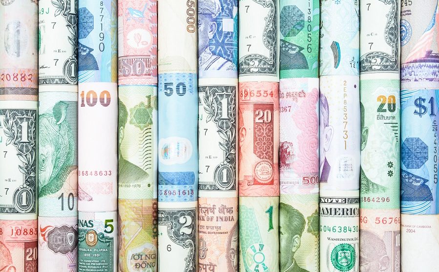 A background with many roll currencies from different countries