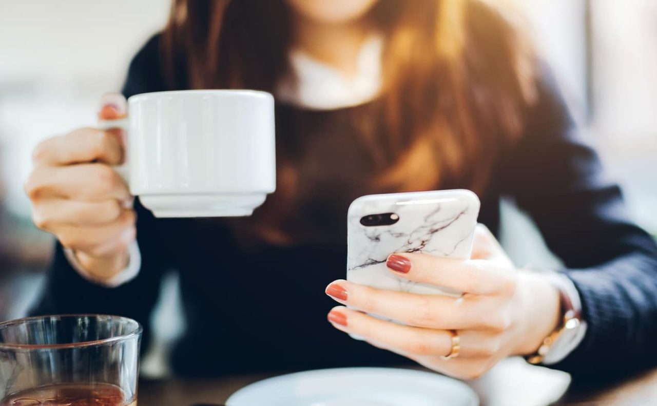 girl with phone and coffee
